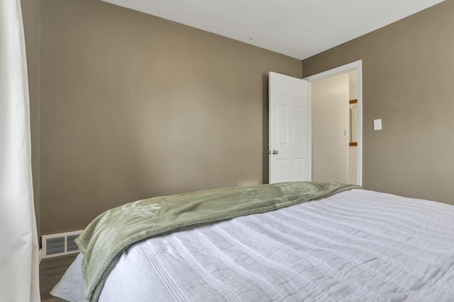 603 S James Rd, Columbus, OH 43213 - bedroom with baseboards, wood finished floors, and visible vents