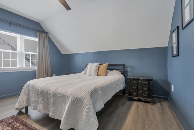 603 S James Rd, Columbus, OH 43213 - bedroom featuring baseboards, wood finished floors, and vaulted ceiling