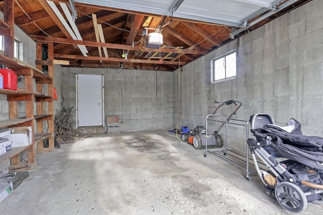 603 S James Rd, Columbus, OH 43213 - garage with concrete block wall and a garage door opener