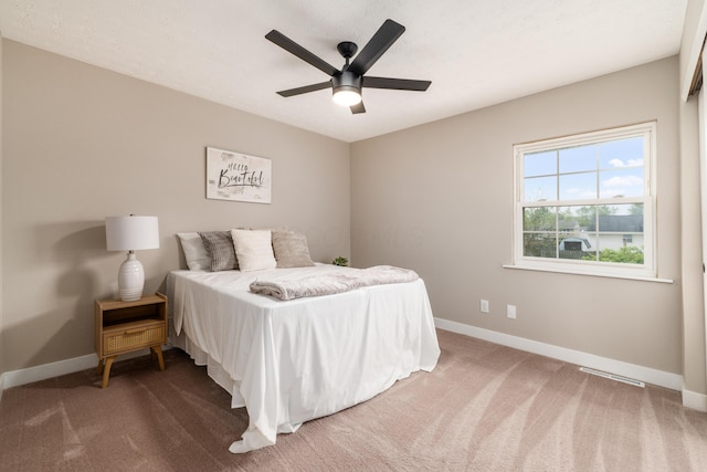bedroom featuring baseboards and carpet flooring