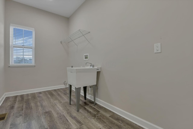 washroom featuring laundry area, hookup for a washing machine, baseboards, wood finished floors, and visible vents