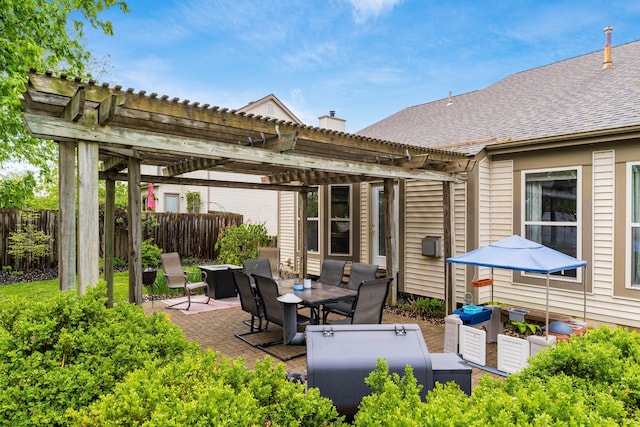 view of patio featuring outdoor dining area, an outdoor living space, fence, and a pergola