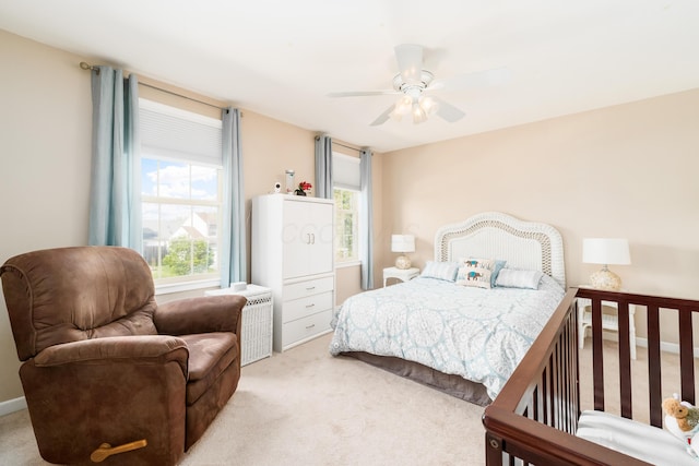 carpeted bedroom featuring ceiling fan