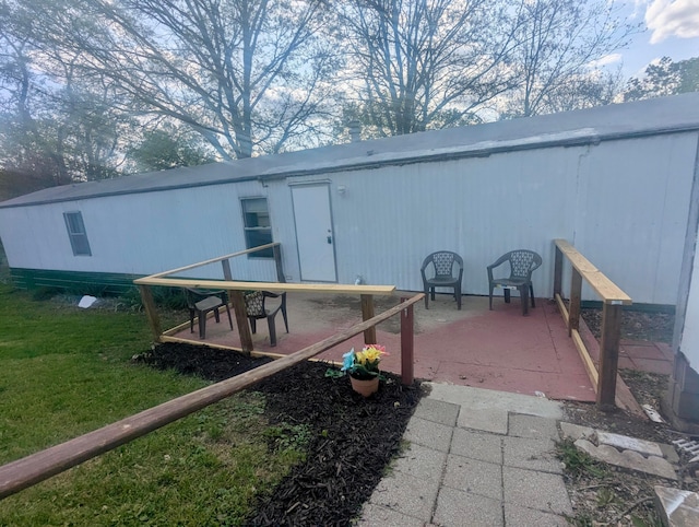 200 Ann St, New Straitsville, OH 43766 - back of property with a lawn and a patio