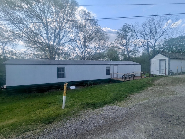 200 Ann St, New Straitsville, OH 43766 - view of front of house with a front lawn, an outbuilding, and a storage shed