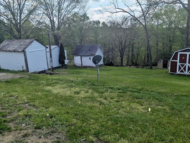 200 Ann St, New Straitsville, OH 43766 - view of grassy yard with a storage shed and an outdoor structure