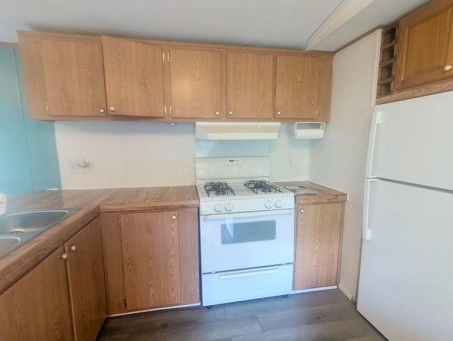 200 Ann St, New Straitsville, OH 43766 - kitchen with white appliances, under cabinet range hood, a sink, and light countertops