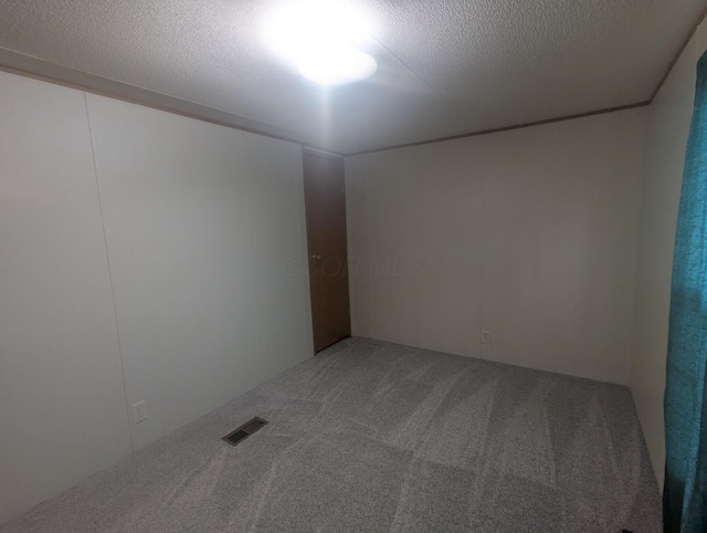 200 Ann St, New Straitsville, OH 43766 - carpeted spare room with a textured ceiling