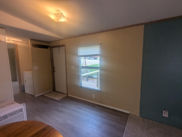 200 Ann St, New Straitsville, OH 43766 - foyer featuring wood finished floors, washer / clothes dryer, and baseboards