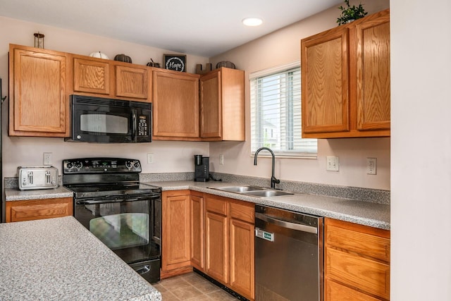 kitchen with a toaster, recessed lighting, light countertops, a sink, and black appliances