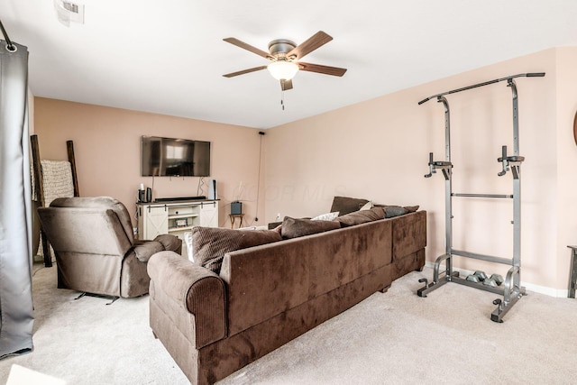 carpeted living room featuring ceiling fan, visible vents, and baseboards
