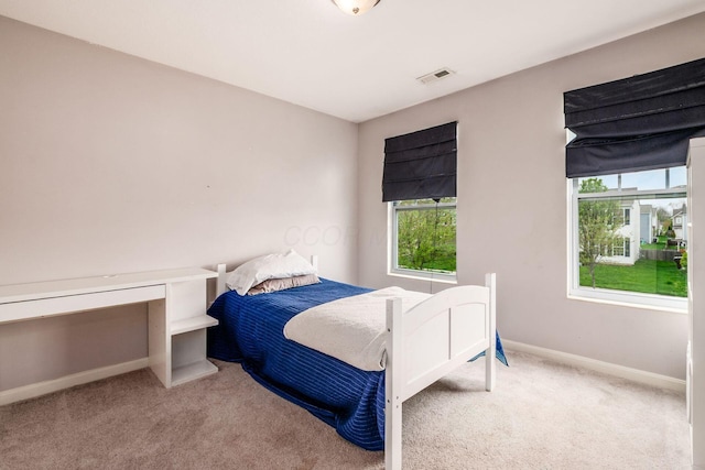bedroom featuring carpet flooring, baseboards, and visible vents
