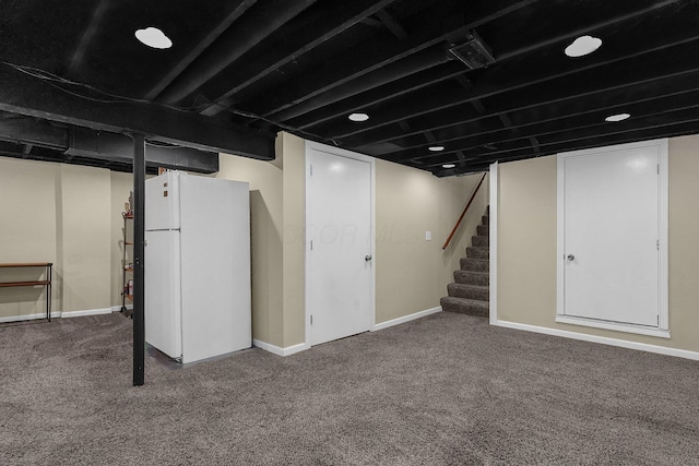 5968 Lisa St, Columbus, OH 43231 - finished basement with freestanding refrigerator, carpet, baseboards, and stairs