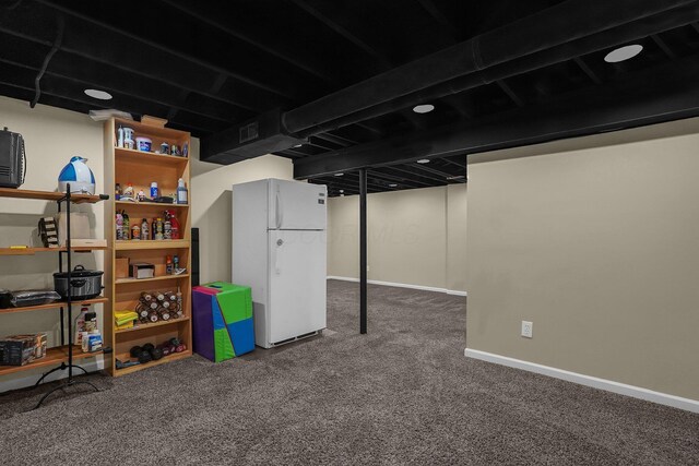 5968 Lisa St, Columbus, OH 43231 - finished basement with freestanding refrigerator, carpet flooring, and baseboards