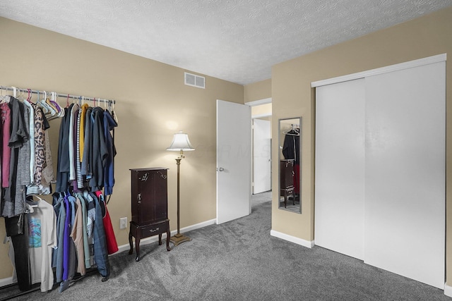 5968 Lisa St, Columbus, OH 43231 - carpeted bedroom featuring baseboards, a textured ceiling, and a closet