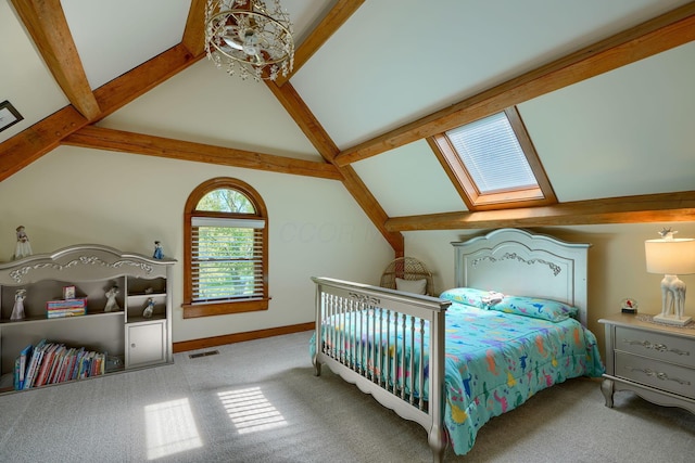 bedroom featuring visible vents, carpet flooring, baseboards, and lofted ceiling with skylight
