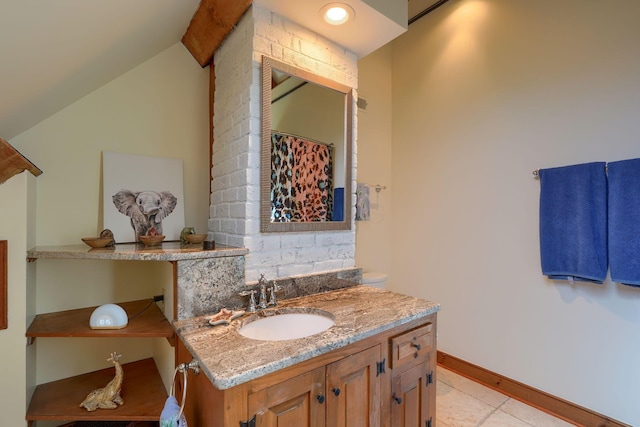 bathroom featuring vanity, curtained shower, baseboards, tile patterned floors, and vaulted ceiling