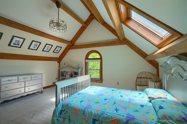 bedroom featuring vaulted ceiling with skylight, carpet floors, and baseboards