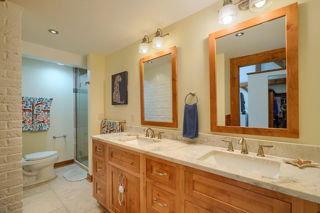 bathroom with toilet, a shower stall, a sink, and tile patterned flooring