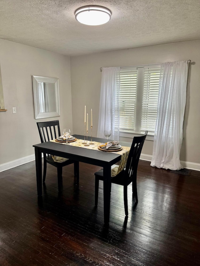 1464 E 26th Ave, Columbus, OH 43211 - dining area featuring hardwood / wood-style floors, baseboards, and a textured ceiling