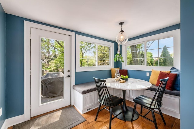 dining area featuring light wood-style floors and breakfast area