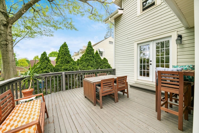 wooden deck featuring outdoor dining space