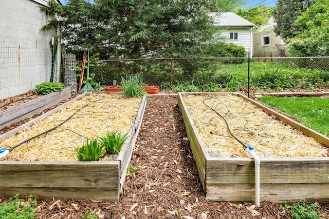 view of yard with a garden and fence