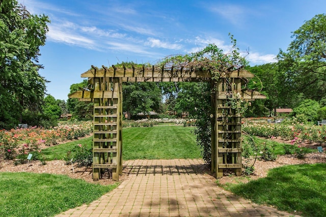 view of gate featuring a yard
