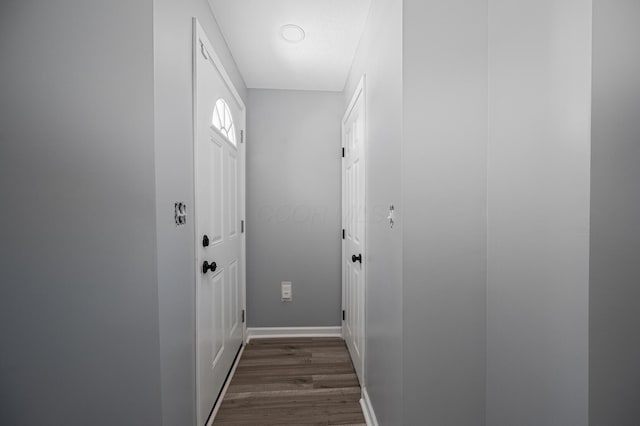 331 E Barthman Ave, Columbus, OH 43207 - doorway to outside featuring baseboards and dark wood-style floors