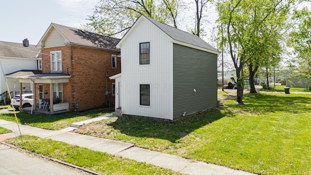 331 E Barthman Ave, Columbus, OH 43207 - view of home's exterior with a lawn and brick siding