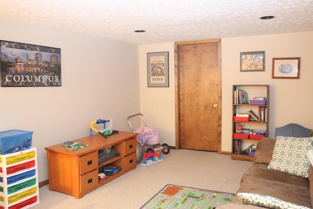 10160 Wellington Dr, Pickerington, OH 43147 - playroom featuring a textured ceiling, light colored carpet, and baseboards