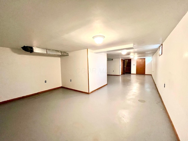 finished basement featuring baseboards