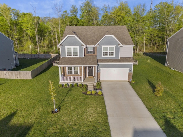 traditional-style house featuring roof with shingles, brick siding, a garage, covered porch, and driveway