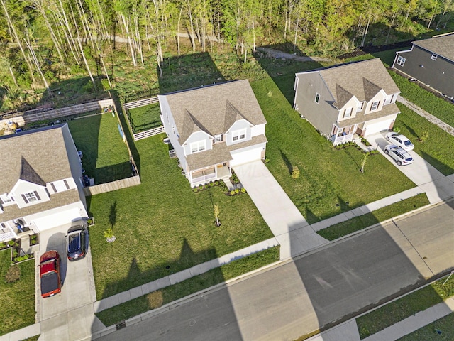 birds eye view of property with a residential view