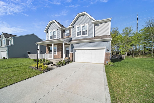 view of front of house with a front yard, brick siding, an attached garage, driveway, and a porch