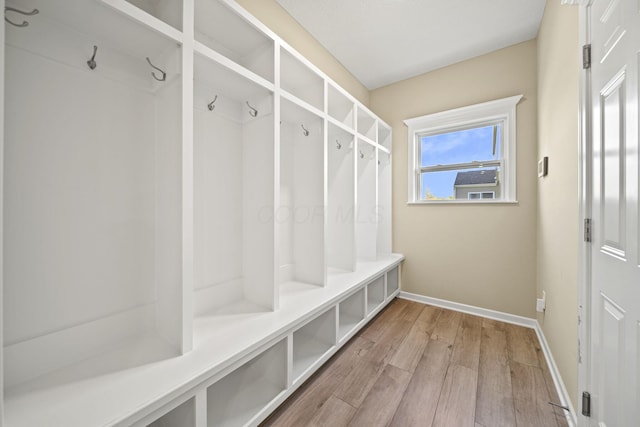mudroom featuring baseboards and light wood-style flooring