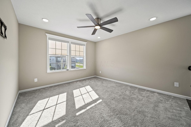 spare room with carpet floors, recessed lighting, ceiling fan, and baseboards