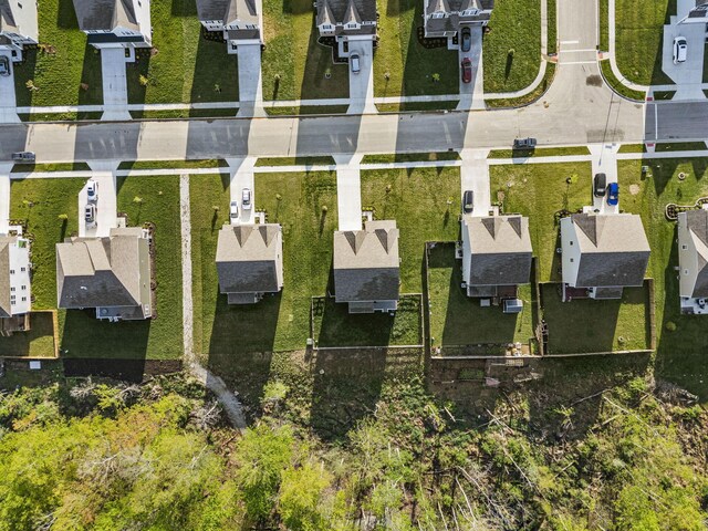 birds eye view of property with a residential view