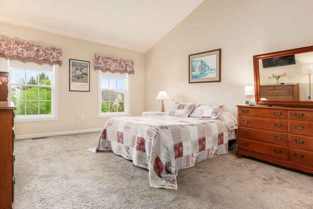 carpeted bedroom featuring baseboards, vaulted ceiling, multiple windows, and visible vents