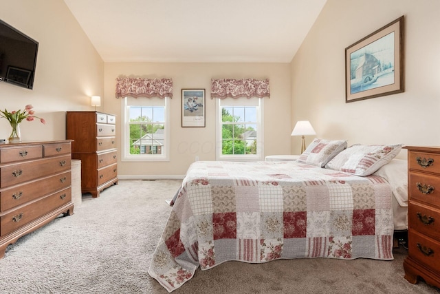 bedroom with baseboards and carpet