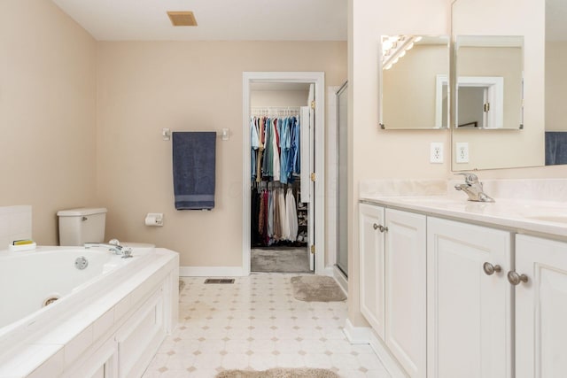bathroom with visible vents, vanity, a tub with jets, baseboards, and a stall shower