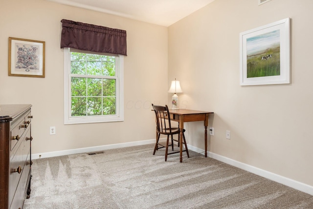 home office with carpet flooring, baseboards, and visible vents