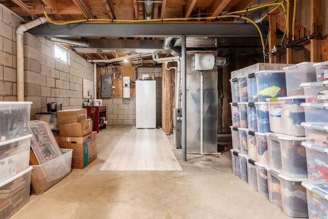 below grade area featuring electric panel and refrigerator