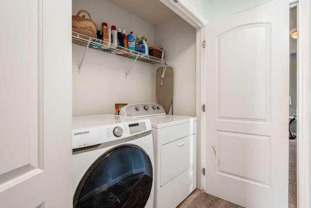laundry area with laundry area and washer and clothes dryer