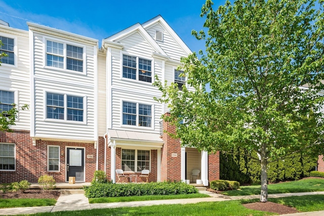multi unit property featuring brick siding
