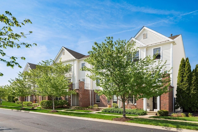 view of front of house featuring brick siding
