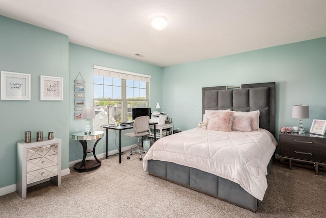 bedroom featuring baseboards, carpet, and visible vents