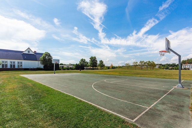 view of sport court with a lawn and community basketball court