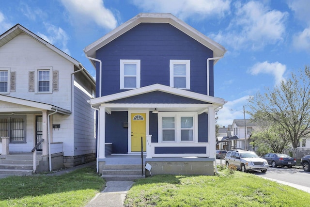 view of front of property with a front lawn and covered porch