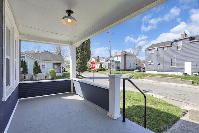 exterior space featuring a residential view and covered porch